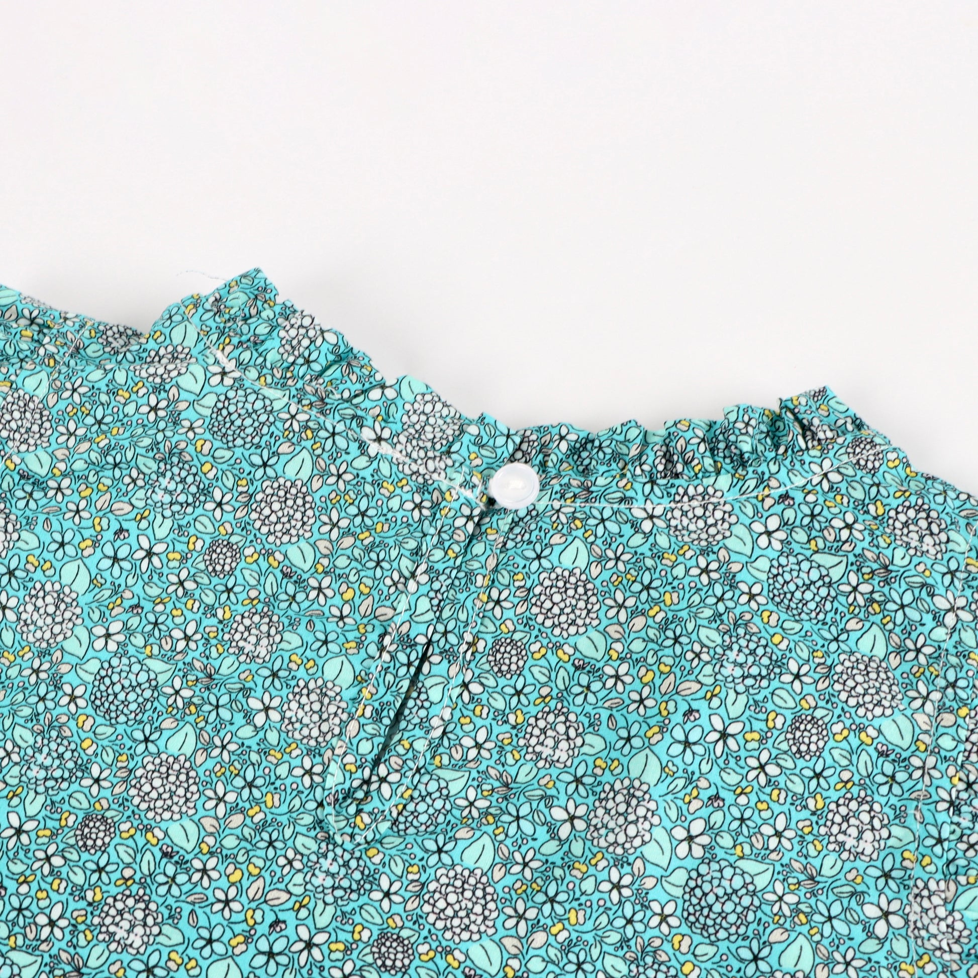 iMiN Kids Ruffles Sleeveless Blouse Button on the Back